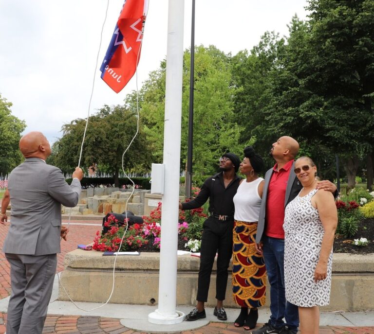 Mayor Brian de Pena raising Juneteenth flag, Michael Bastien, Lisa Miller-Gillespie, Senator Pavel Payano, Councilor at Large Ana Levy